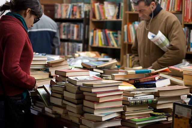 bookstore staff arranging book display table
